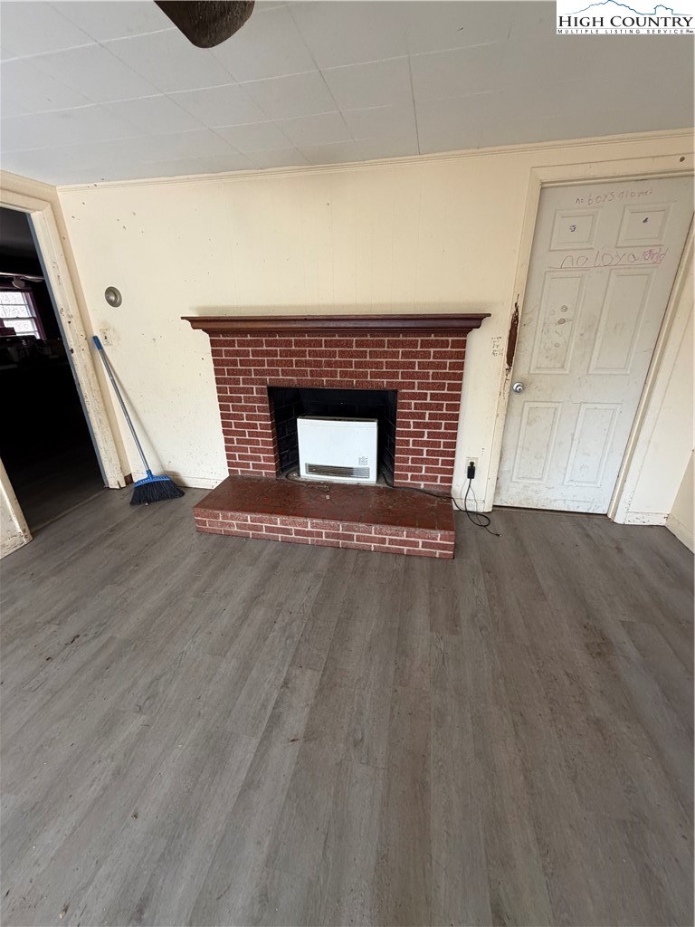 733 Clark Swift Road Vilas, NC 28692 - Photo 29 of 36 a view of an empty room with wooden floor and a window
