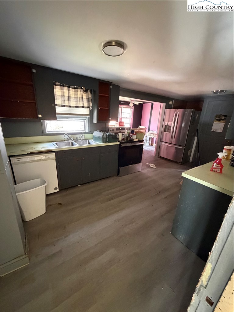 733 Clark Swift Road Vilas, NC 28692 - Photo 30 of 36 a large kitchen with kitchen island granite countertop a sink and a stove