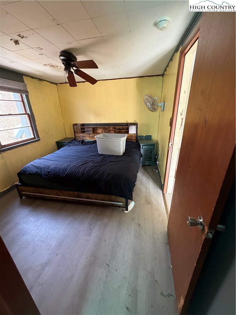 733 Clark Swift Road Vilas, NC 28692 - Photo 33 of 36 a bedroom with a bed and a window