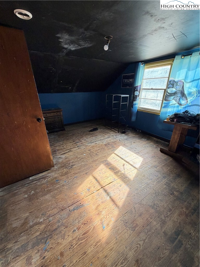 733 Clark Swift Road Vilas, NC 28692 - Photo 36 of 36 a view of an empty room with a fireplace and a window