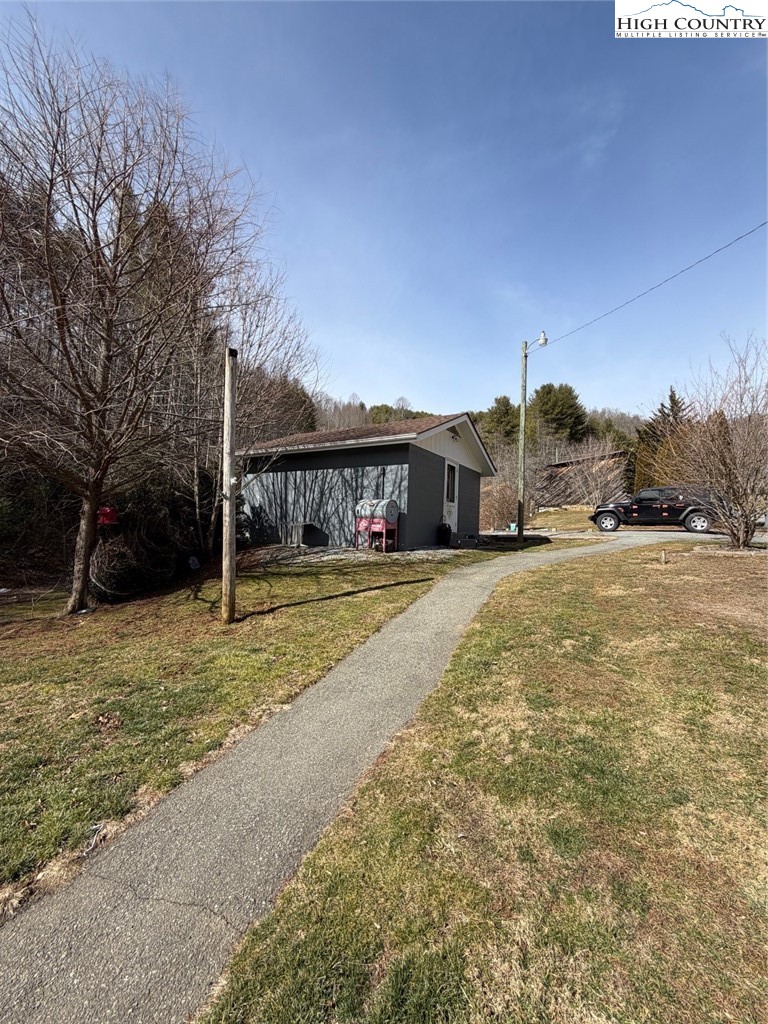 733 Clark Swift Road Vilas, NC 28692 - Photo 9 of 36 a view of house with yard and trees in the background