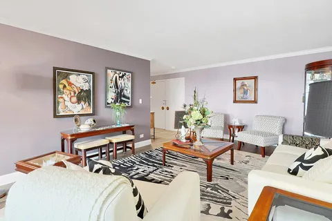 a living room with furniture and a window