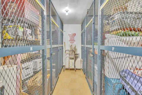 a view of staircase with railing and a rug