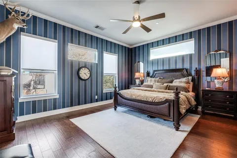 a spacious bedroom with a large bed and a window