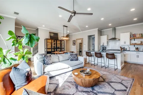 a living room with furniture and a rug