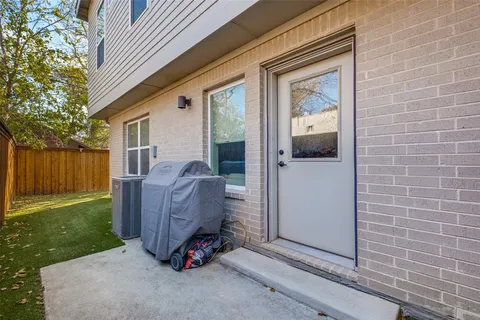 a view of backyard with cabin and wooden fence