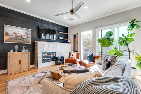 a bedroom with furniture and a large window