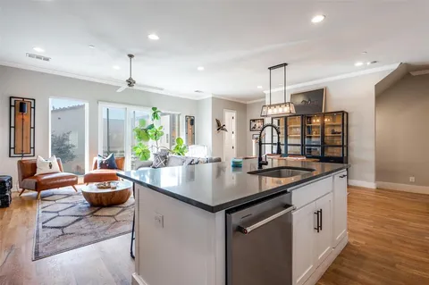 a kitchen with stainless steel appliances granite countertop a sink and stove