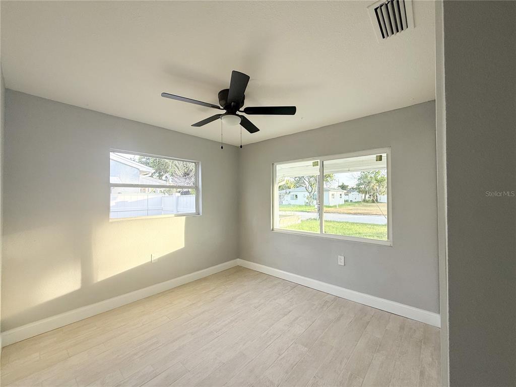 14000 Miramar Avenue, Unit A Madeira Beach, FL 33708 - Photo 12 of 20 a view of an empty room with a window
