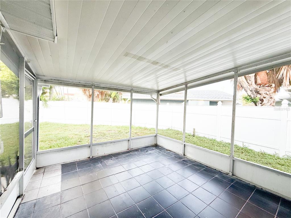 14000 Miramar Avenue, Unit A Madeira Beach, FL 33708 - Photo 18 of 20 a view of an empty room with windows