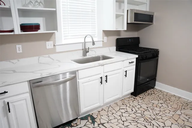 a bathroom with a sink and a shower