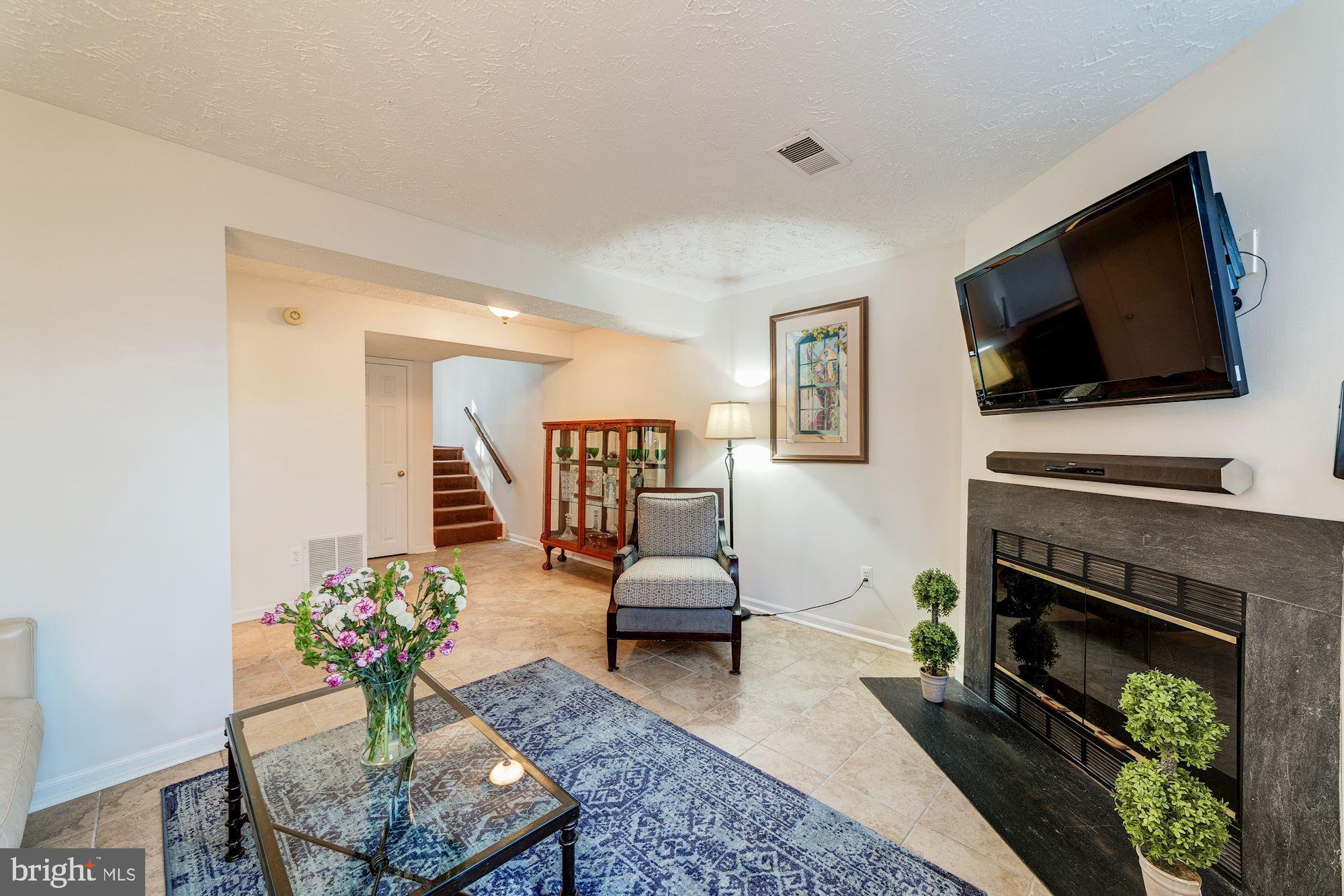 1591 Woodcrest Drive Reston, VA 20194 - Photo 10 of 33 Fabulous wood burning fireplace in family room