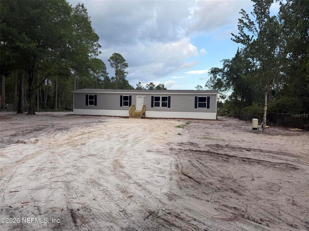 114 Nutmeg Trail Interlachen, FL 32148 - Photo 33 of 33 a front view of house with yard and trees around