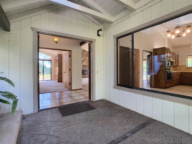 a view of a living room and entry way