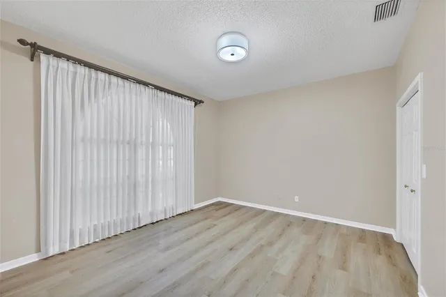 a front view of a house with a yard porch and furniture