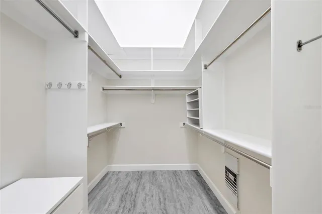 an aerial view of a city with lots of residential buildings and mountain view in back