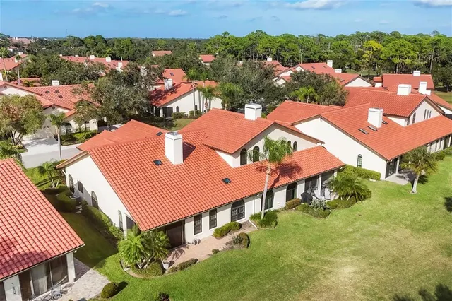 a front view of a house with swimming pool having outdoor seating