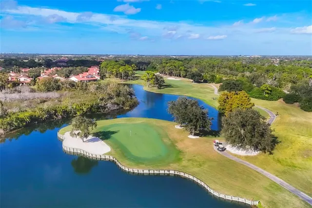 a view of a golf course with a lake