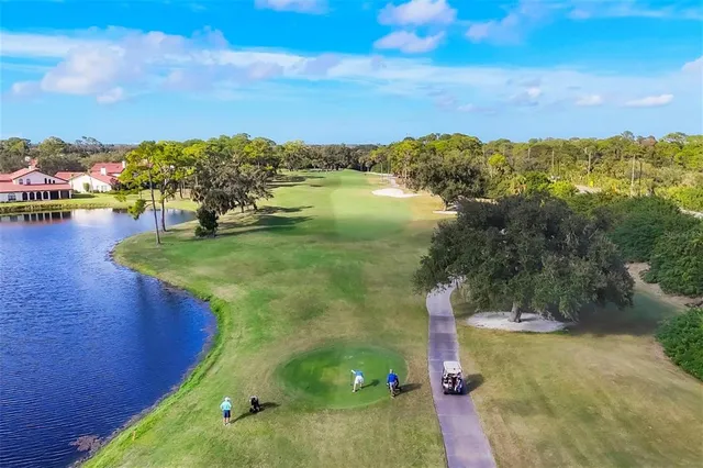 an aerial view of a house with a lake view