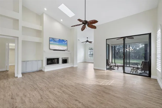 a view of a dining room with furniture wooden floor and chandelier