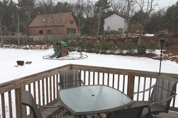 280 River St Extension Billerica, MA 01821 - Photo 20 of 23 a view of a balcony with a table and chairs