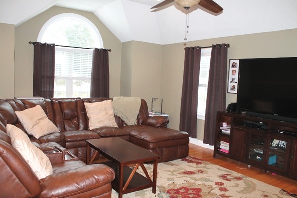 280 River St Extension Billerica, MA 01821 - Photo 2 of 23 a living room with furniture and a flat screen tv