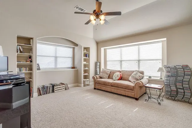 a bed room with a bed and a chair