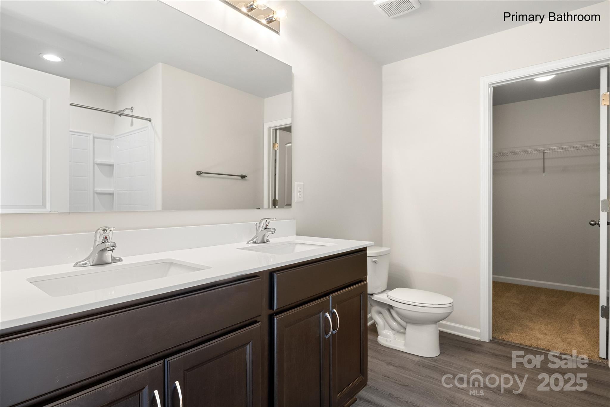 300 Elm Street Lancaster, SC 29720 - Photo 24 of 43 a bathroom with a sink a toilet and a mirror