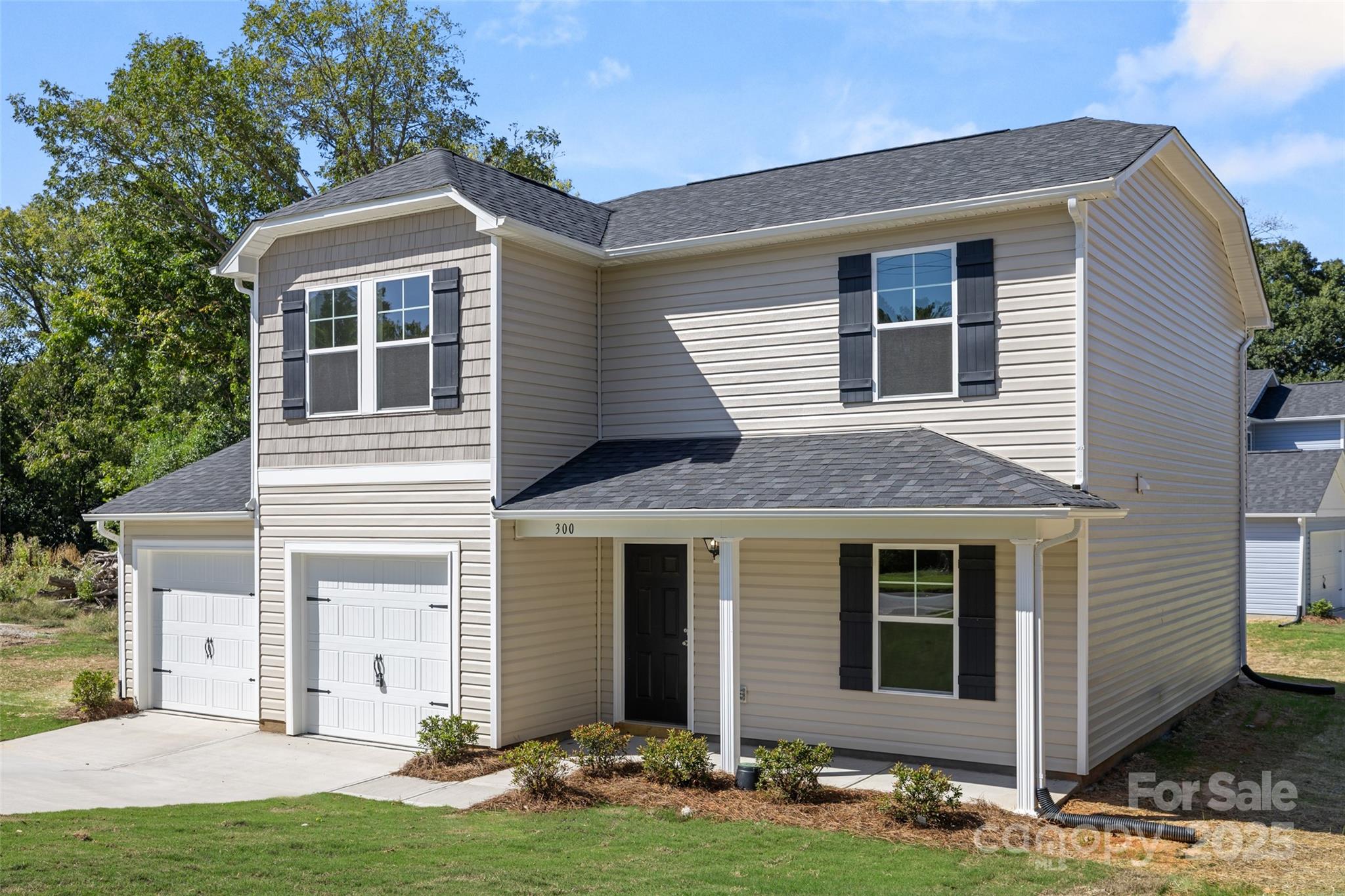 300 Elm Street Lancaster, SC 29720 - Photo 3 of 43 a front view of a house with a yard and garage