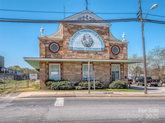 a view of a building with a yard