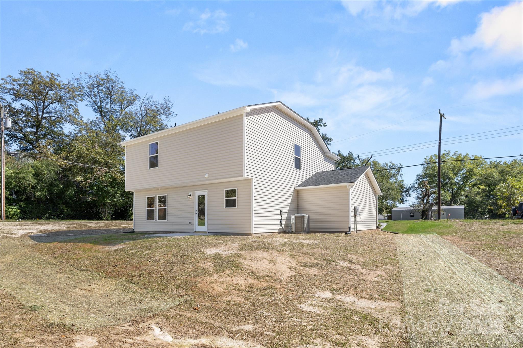 300 Elm Street Lancaster, SC 29720 - Photo 5 of 43 a view of a white house with a yard