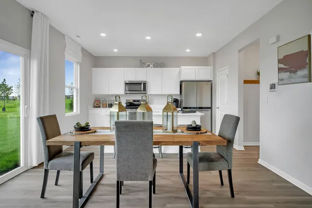 a dining room with furniture and window