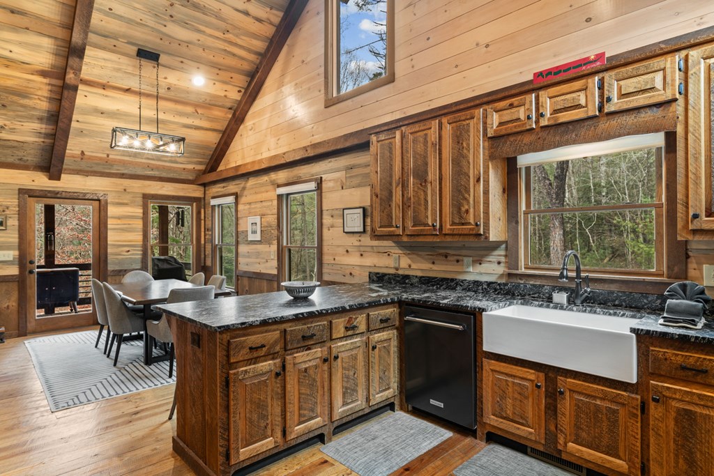 15 Bootleg Mountain Road Morganton, GA 30560 - Photo 17 of 67 a kitchen with stainless steel appliances granite countertop a sink stove and cabinets