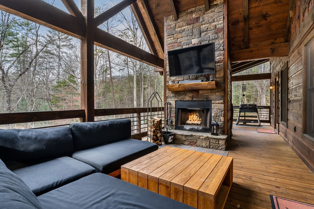 15 Bootleg Mountain Road Morganton, GA 30560 - Photo 23 of 67 a living room with furniture and a fireplace