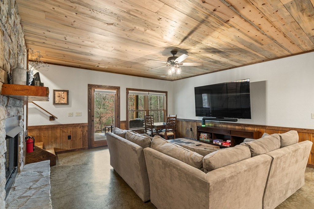 15 Bootleg Mountain Road Morganton, GA 30560 - Photo 36 of 67 a living room with furniture and a flat screen tv