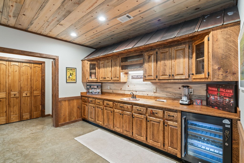 15 Bootleg Mountain Road Morganton, GA 30560 - Photo 37 of 67 a large kitchen with stainless steel appliances granite countertop wooden cabinets a sink and dishwasher