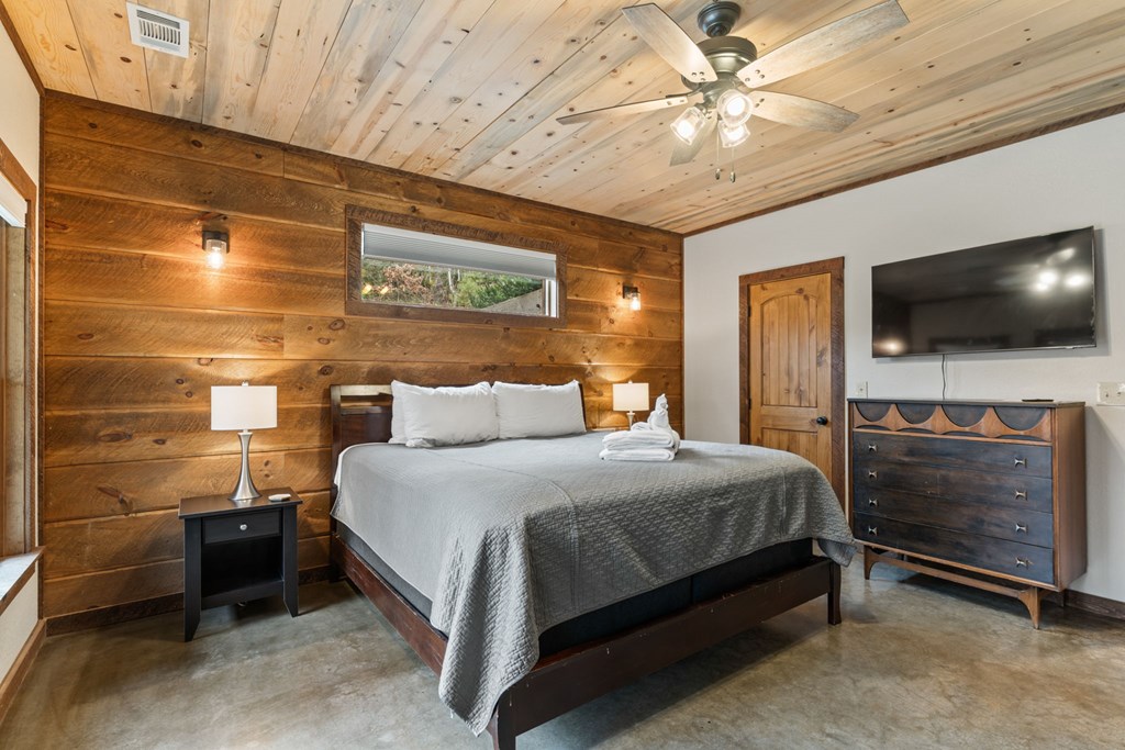 15 Bootleg Mountain Road Morganton, GA 30560 - Photo 41 of 67 a bedroom with a bed and a flat screen tv