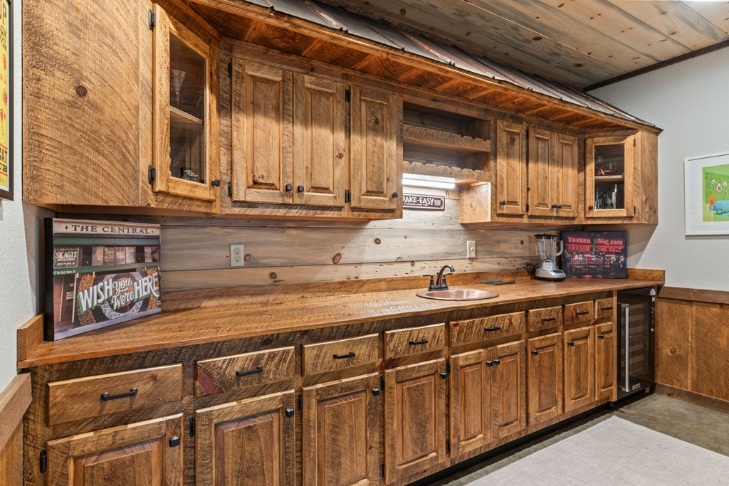 15 Bootleg Mountain Road Morganton, GA 30560 - Photo 42 of 67 a kitchen with stainless steel appliances granite countertop a sink and cabinets