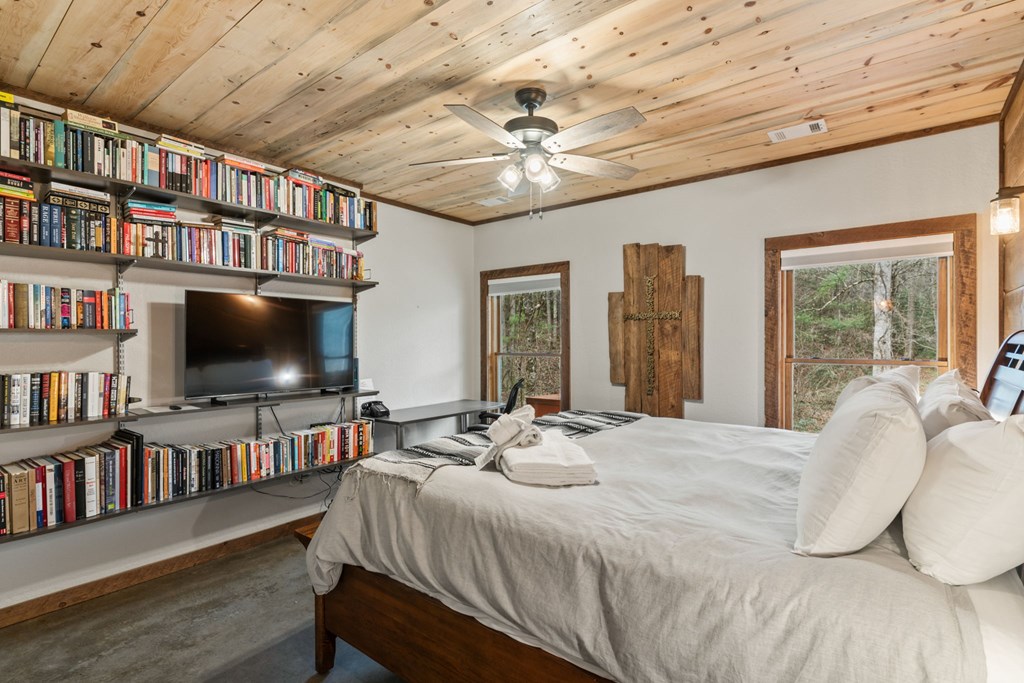 15 Bootleg Mountain Road Morganton, GA 30560 - Photo 43 of 67 a bedroom with furniture and a flat screen tv