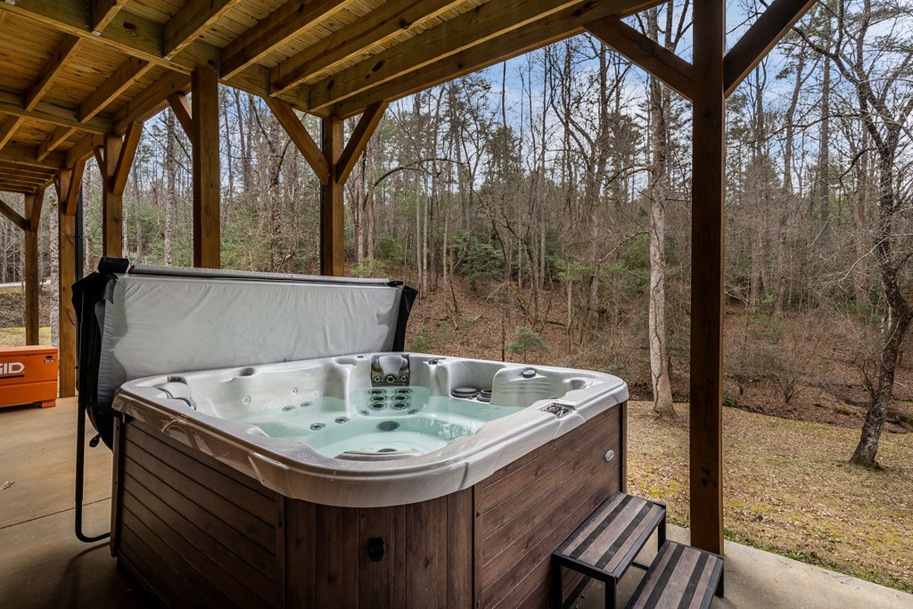 15 Bootleg Mountain Road Morganton, GA 30560 - Photo 49 of 67 a bath tub sitting in a bathroom next to a sink