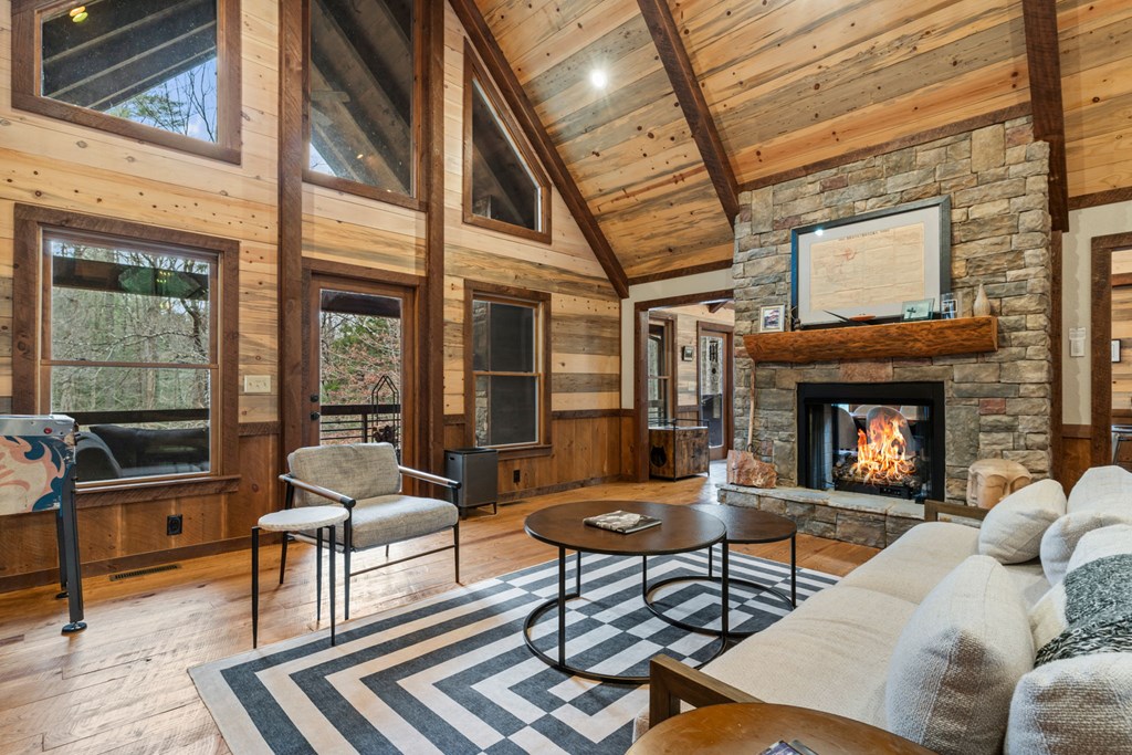 15 Bootleg Mountain Road Morganton, GA 30560 - Photo 8 of 67 a living room with furniture a fireplace and a table