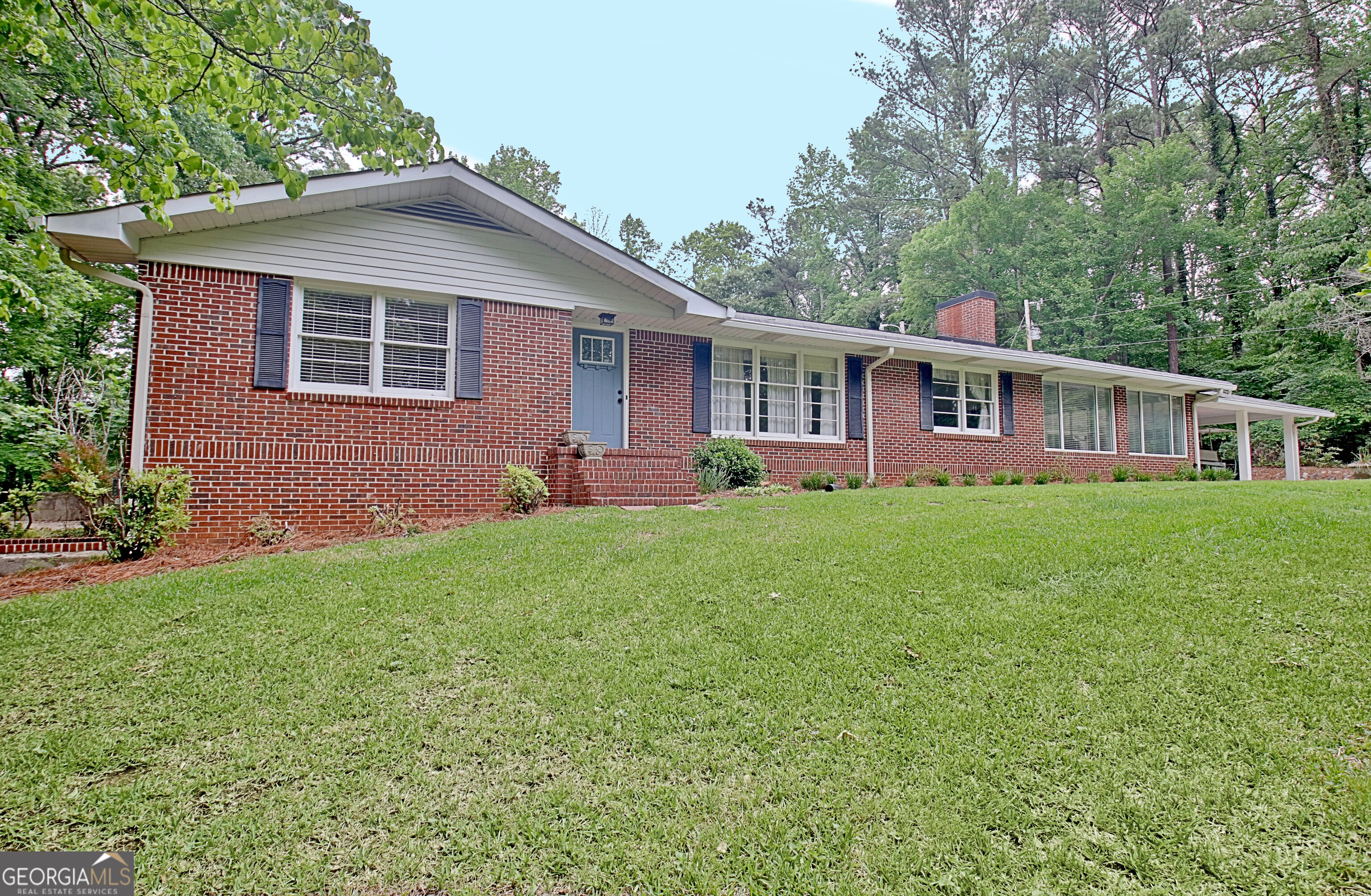717 Tyrone Road Tyrone, GA 30290 - Photo 57 of 58 a front view of a house with a yard and green space