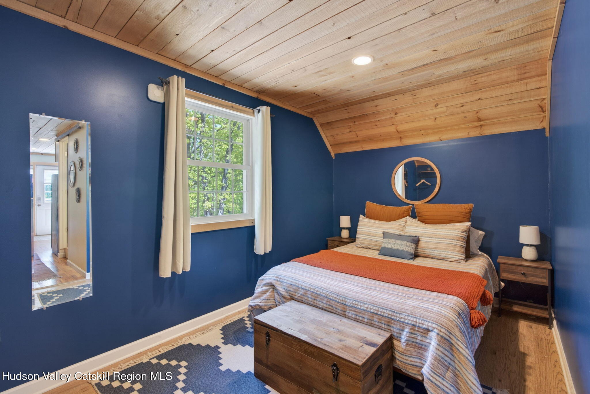 322 Morrison Road Acra, NY 12405 - Photo 38 of 49 a bedroom with a bed and wooden floor