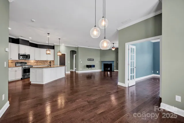 a view of kitchen with cabinets and wooden floor