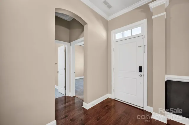 a view of entryway with wooden floor