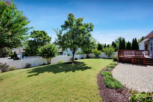 a view of a backyard with sitting area