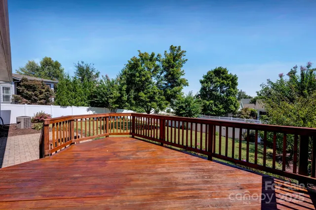 a balcony with wooden floor