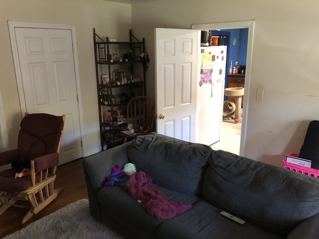 441 Main Street Hardwick, MA 01031 - Photo 12 of 26 a living room with furniture and a couch