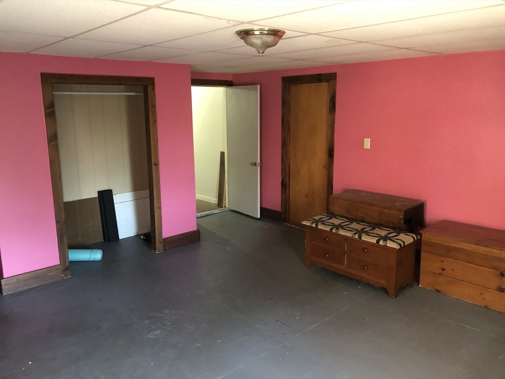 441 Main Street Hardwick, MA 01031 - Photo 16 of 26 a living room with furniture and a flat screen tv