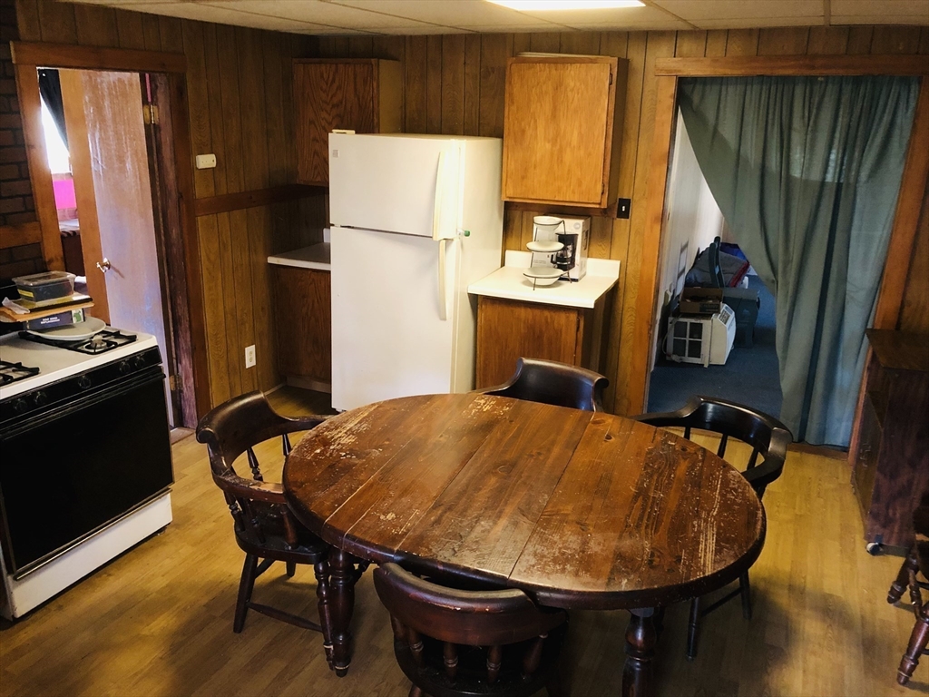 441 Main Street Hardwick, MA 01031 - Photo 20 of 26 a bed room with a bed and a table